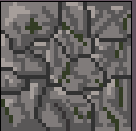 A grey cobblestone tile, stones of several shapes packed together with thin green growth in the gaps between them.