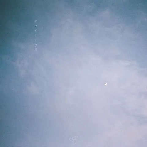 Cover of EDEN’s vertigo: a pale blue sky with thin clouds and a small crescent moon